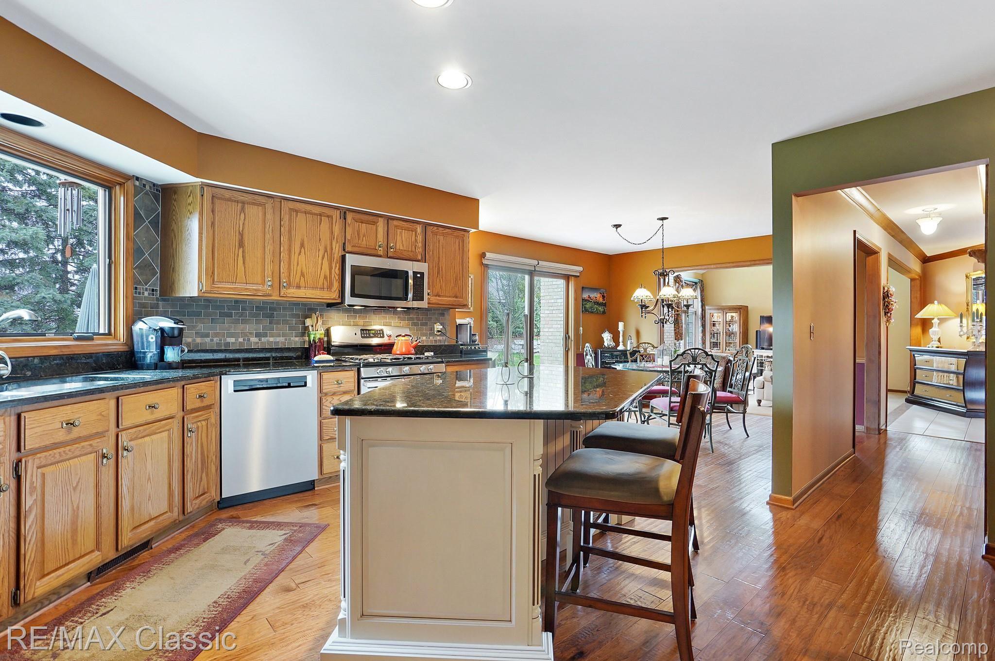 18991 Van Road Livonia, MI 48152 - Photo 27 of 47 Wood Flooring Through Kitchen, Nook and Main Hallway