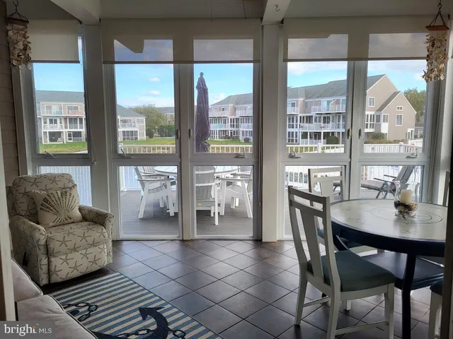 a living room with a fireplace and a flat screen tv