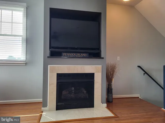 an aerial view of residential houses with outdoor space and lake view