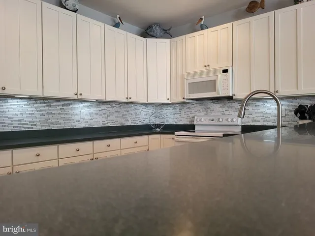 a view of a balcony with furniture