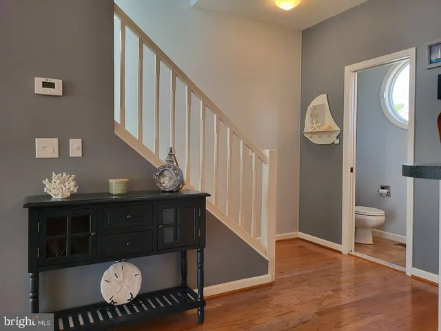 a bedroom with a bed and a lamp