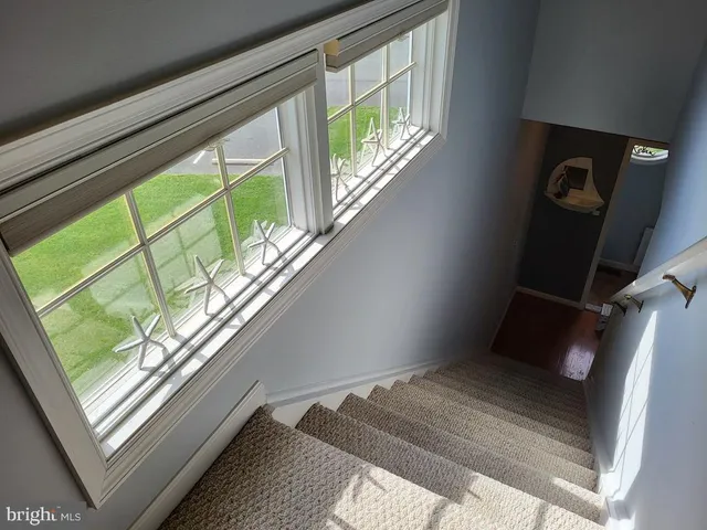 a bathroom with a painting on the wall and a shower