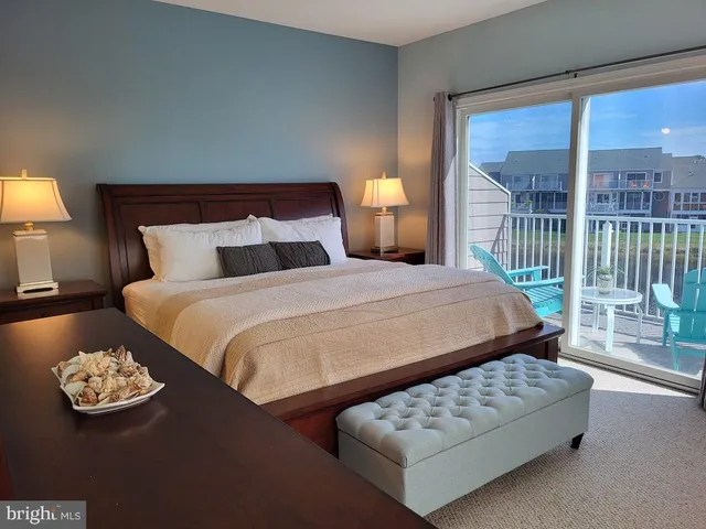 a front view of a house with plants