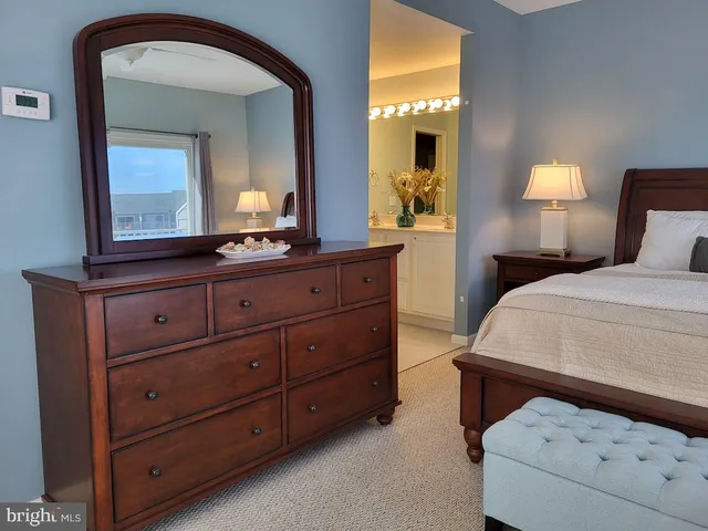an aerial view of a house with a swimming pool and outdoor seating