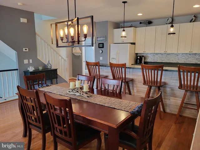 a view of a balcony with furniture and wooden floor