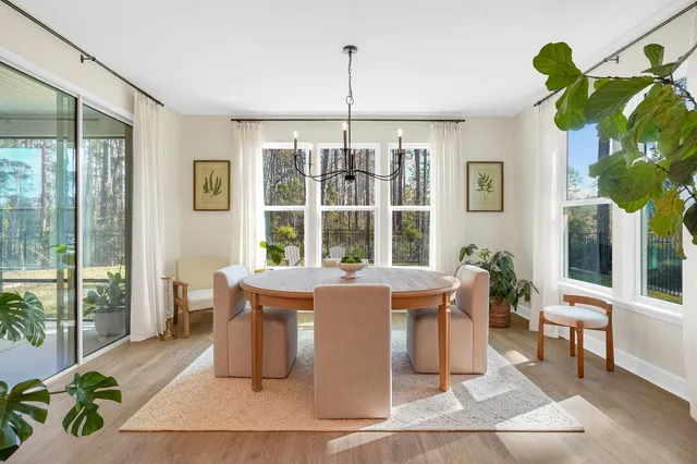 a view of a dining room with furniture window and outside view