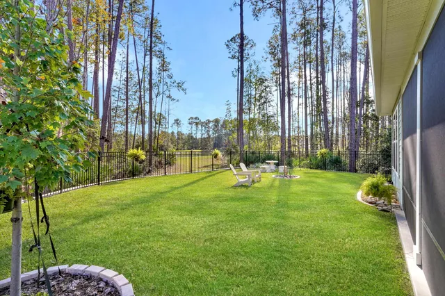 a front view of a house with a yard table and chairs