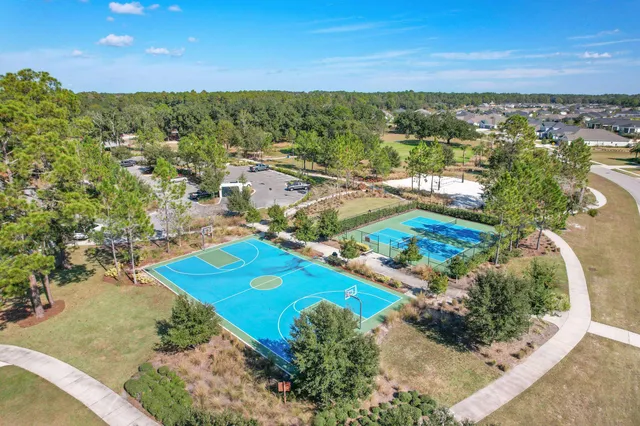 an aerial view of residential building and lake