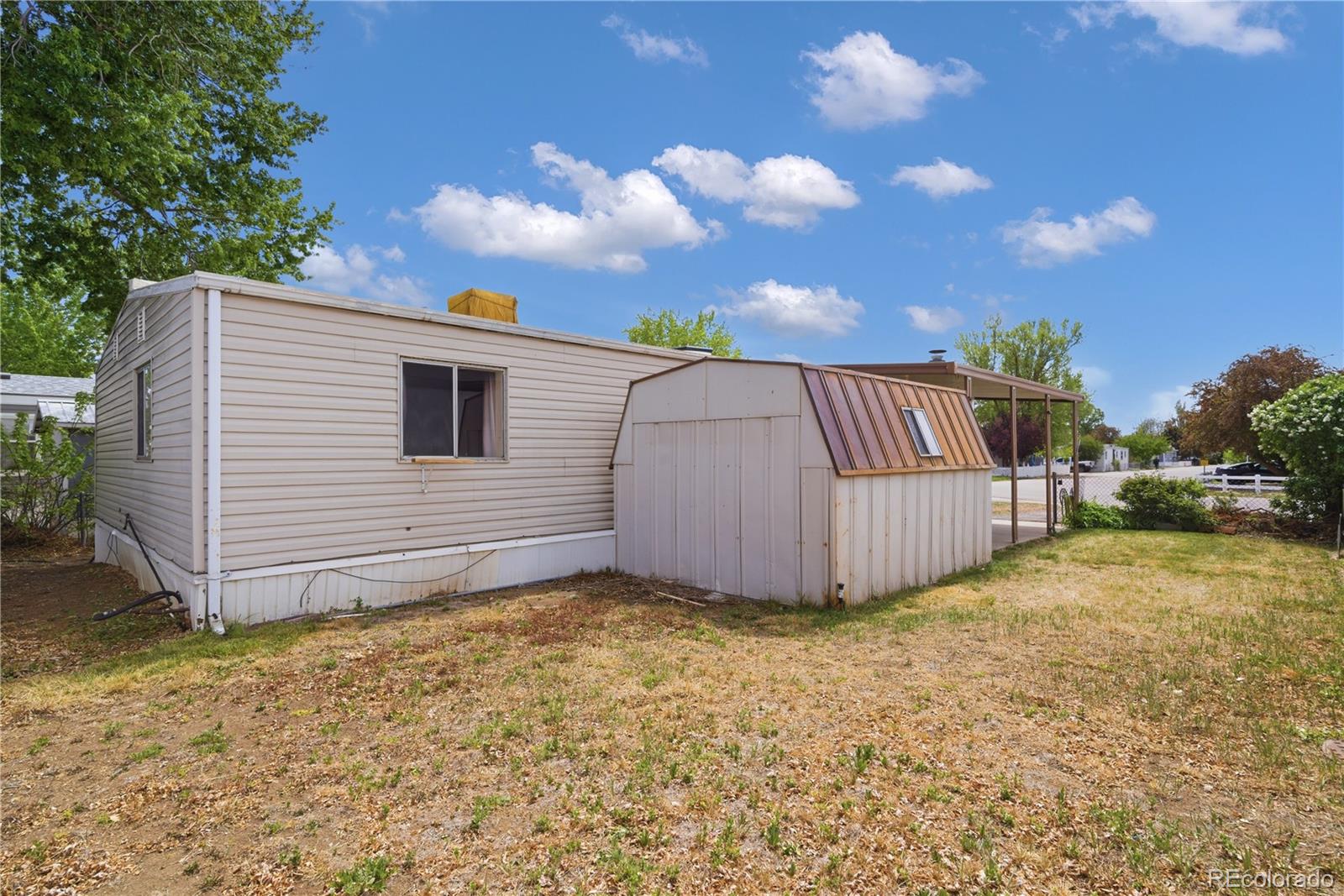 12205 Perry Street Broomfield, CO 80020 - Photo 21 of 22 a view of a backyard