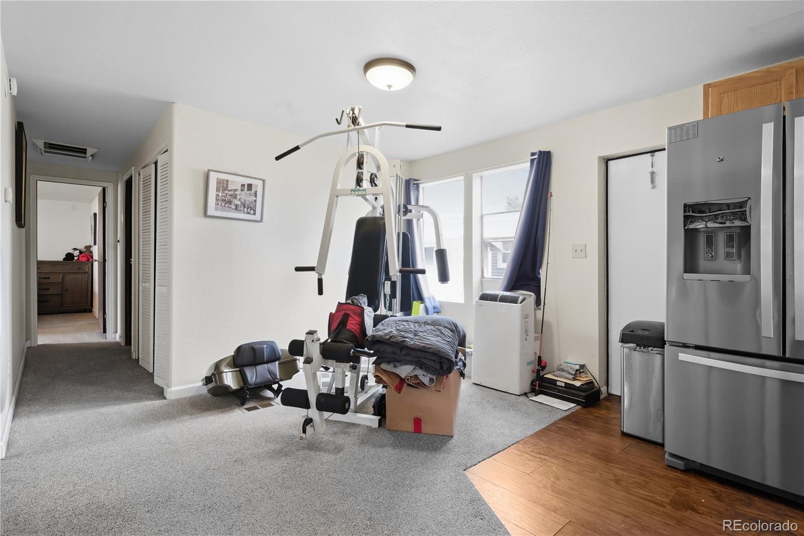 12205 Perry Street Broomfield, CO 80020 - Photo 7 of 22 a view of a room with gym equipment