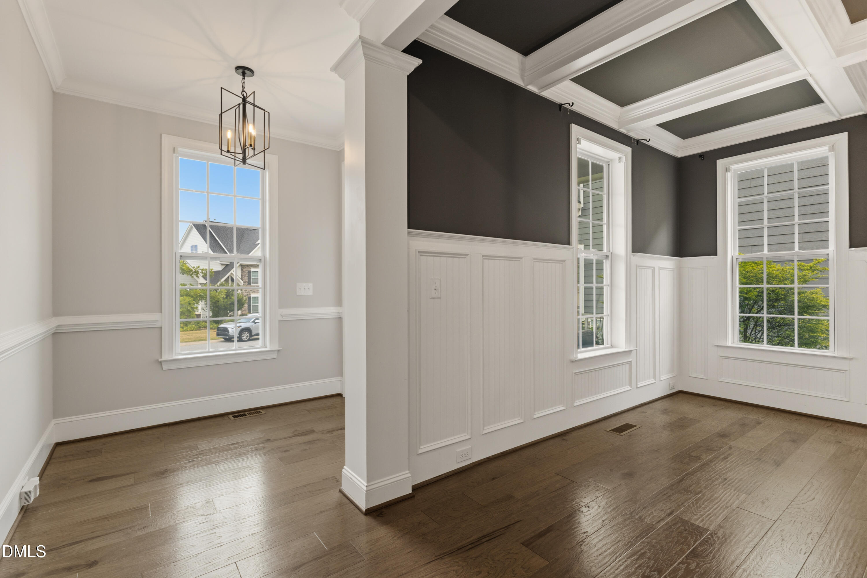 7421 Stonehenge Farm Lane Raleigh, NC 27613 - Photo 15 of 48 a view of an empty room with wooden floor and a window