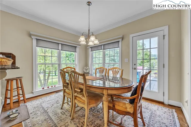 a dining room with furniture window wooden floor