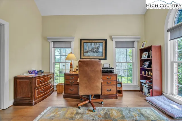 a workspace with furniture and window