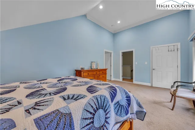 a bedroom with a bed and a table in it