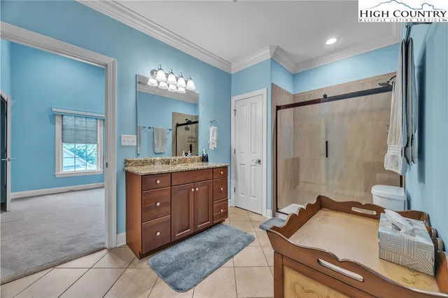 a bathroom with a sink double vanity and a mirror