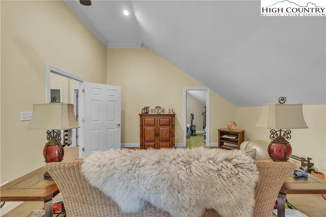 a bed room with a bed and a television