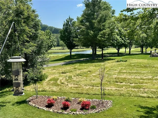 an aerial view of a house with outdoor space and street view