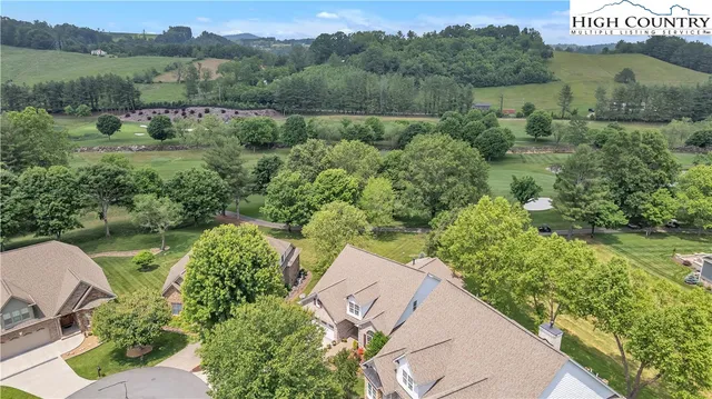 a front view of a house with a garden and sitting area