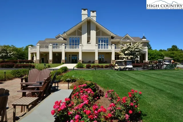a front view of a house with a big yard