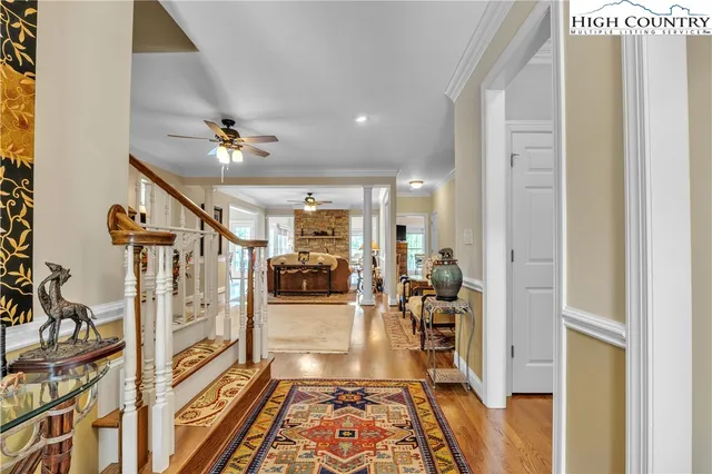 a very nice looking room with a dining table a chandelier
