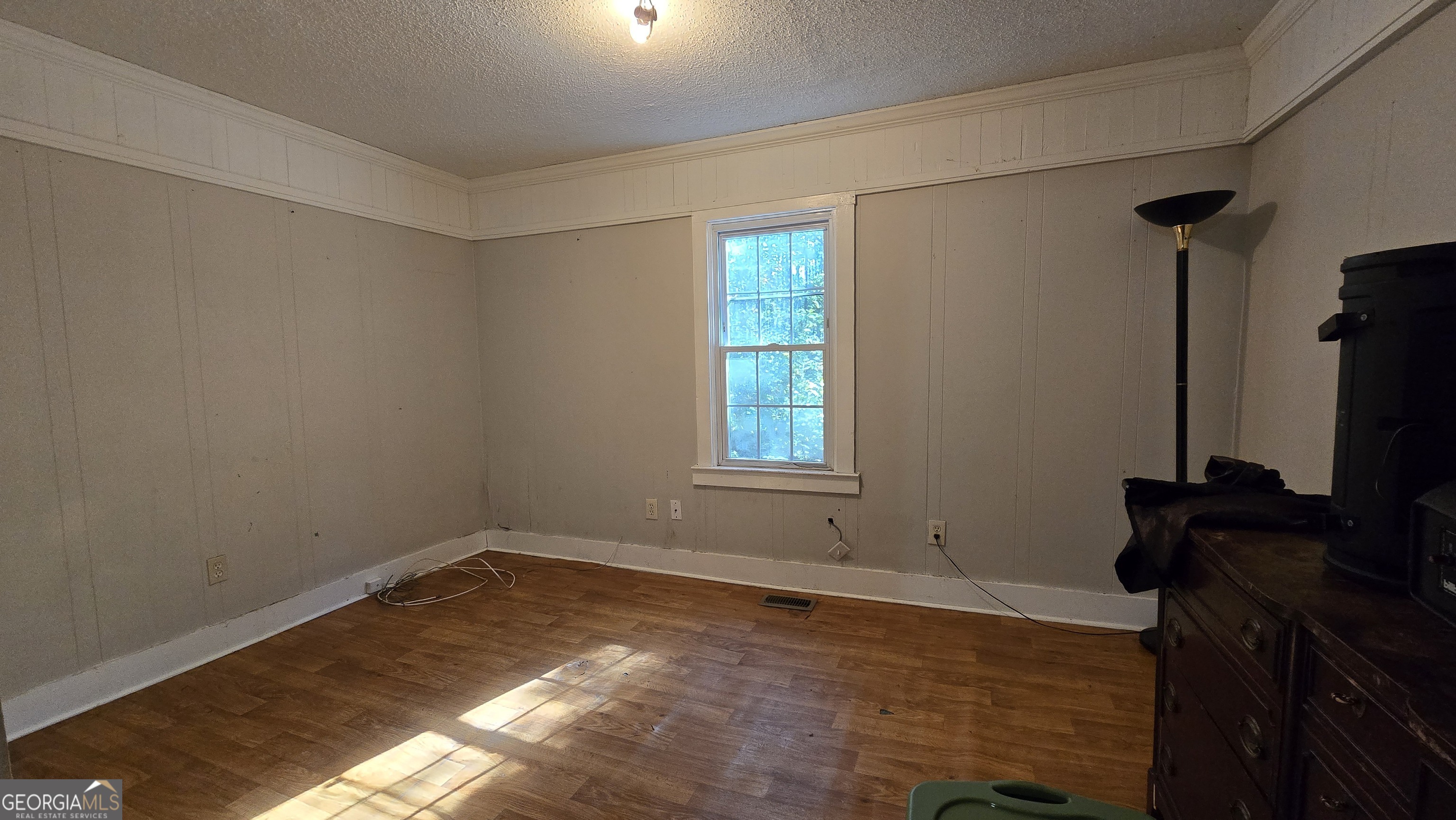 377 Dock Hyde Road Carrollton, GA 30116 - Photo 20 of 31 a view of a room with wooden floor air conditioner and windows
