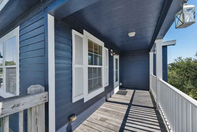 a view of a balcony with wooden floor