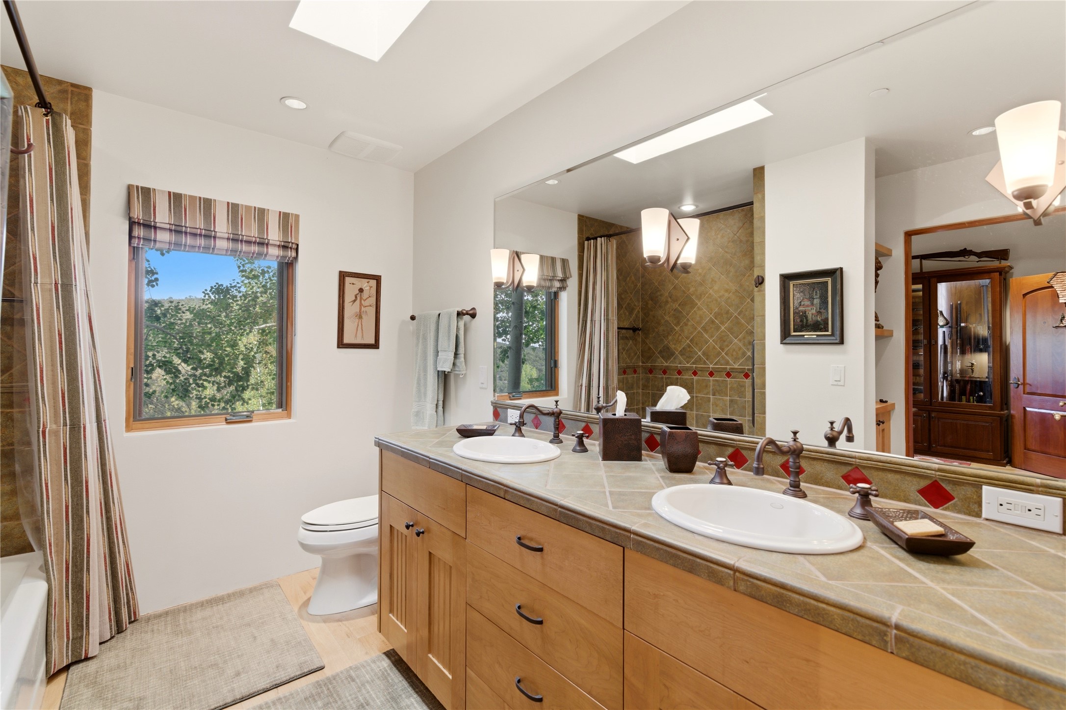 1008 South Summit Ridge Santa Fe, NM 87501 - Photo 30 of 42 Second Bath has dual vanities and connects the second and third bedrooms