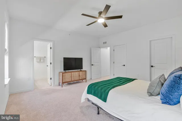 a bedroom with a bed and window