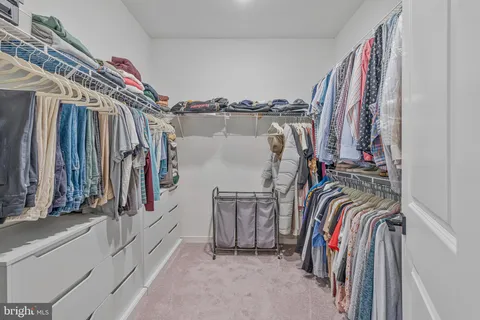 a bedroom with a large bed and a flat screen tv