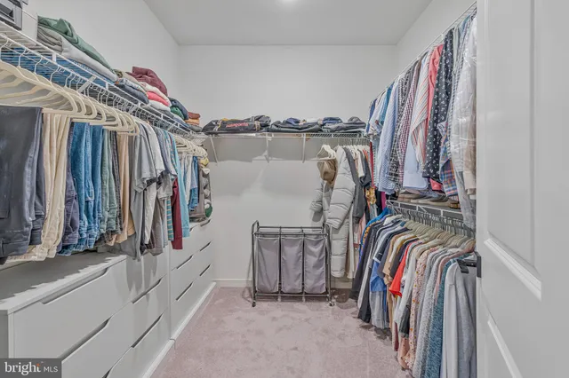 a bedroom with a large bed and a flat screen tv