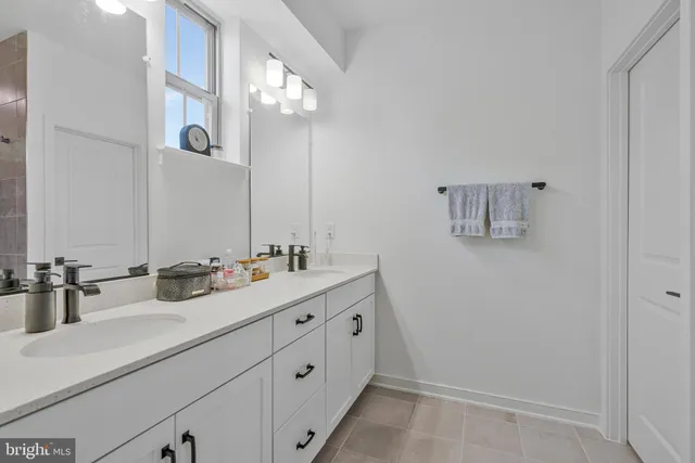 a view of walk in closet with clothes