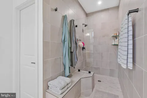a bathroom with a double vanity sink and mirror