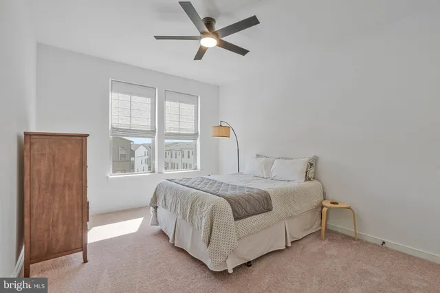 a bathroom with a granite countertop sink a shower and a mirror