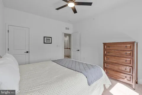 a bed room with a bed and a window