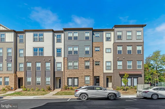 a view of a car parked in front of a building