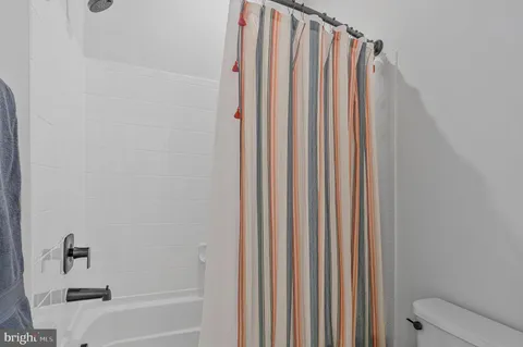 a view of a livingroom with furniture and hardwood floor