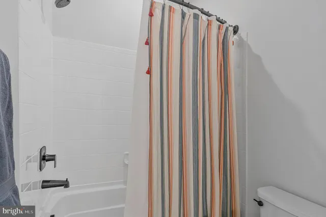 a view of a livingroom with furniture and hardwood floor