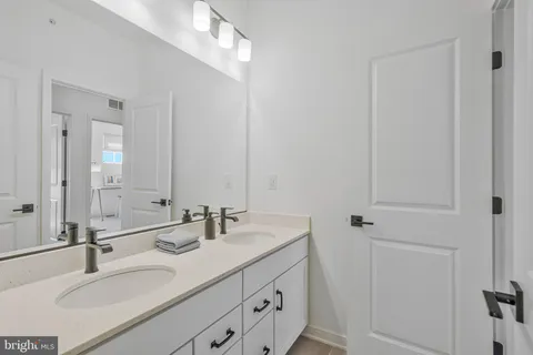a bathroom with a shower curtain and a sink