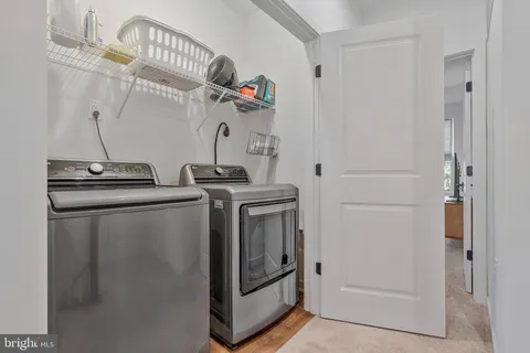 a bathroom with double vanity sink and a mirror