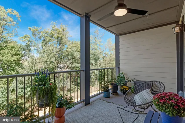 a view of a balcony with chairs