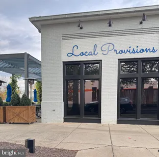 a view of a street with stores