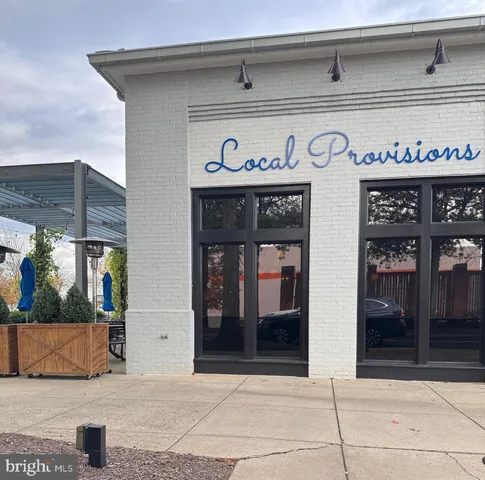 a view of a street with stores