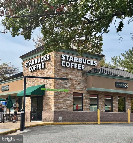 a front view of a building with retail shops