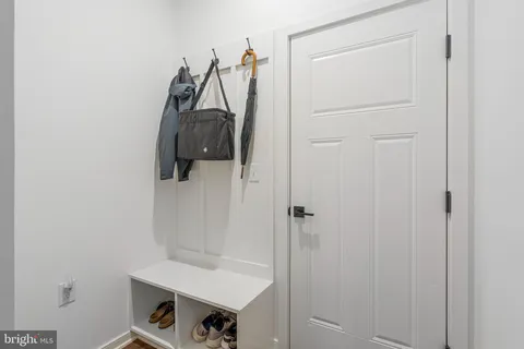 a view of storage and utility room with closet