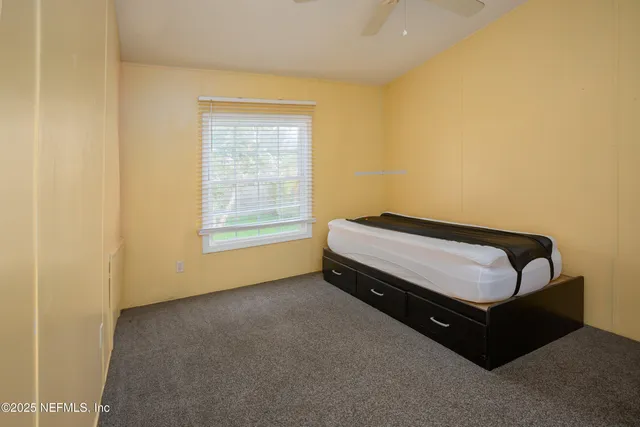 a room with a bed and a window