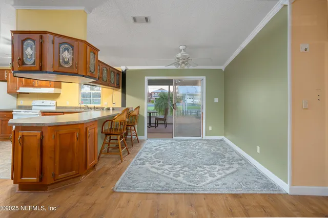 an entryway with wooden floor