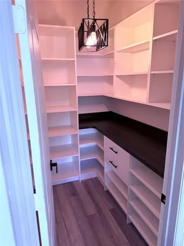 a kitchen with granite countertop stainless steel appliances and cabinets