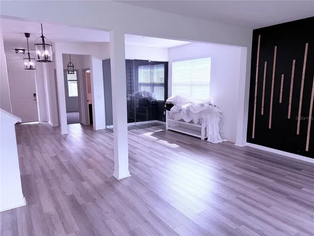 a kitchen with kitchen island a counter top space appliances and a window