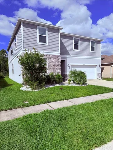 an aerial view of a house with a garden