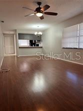13250 Ridge Road, Unit 3B1 Largo, FL 33778 - Photo 5 of 15 a view of a room with gym equipment and a ceiling fan